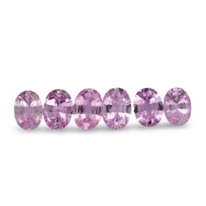 Row of oval lilac loose gemstones