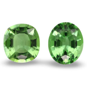 Pair of oval lime green loose gemstones