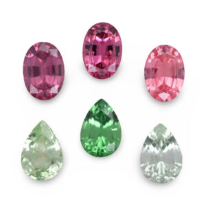 Six assorted pink and green loose gemstones