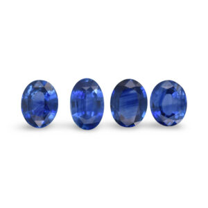 Row of four oval blue loose gemstones