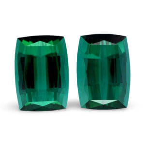 Pair of cushion-cut teal green loose gemstones